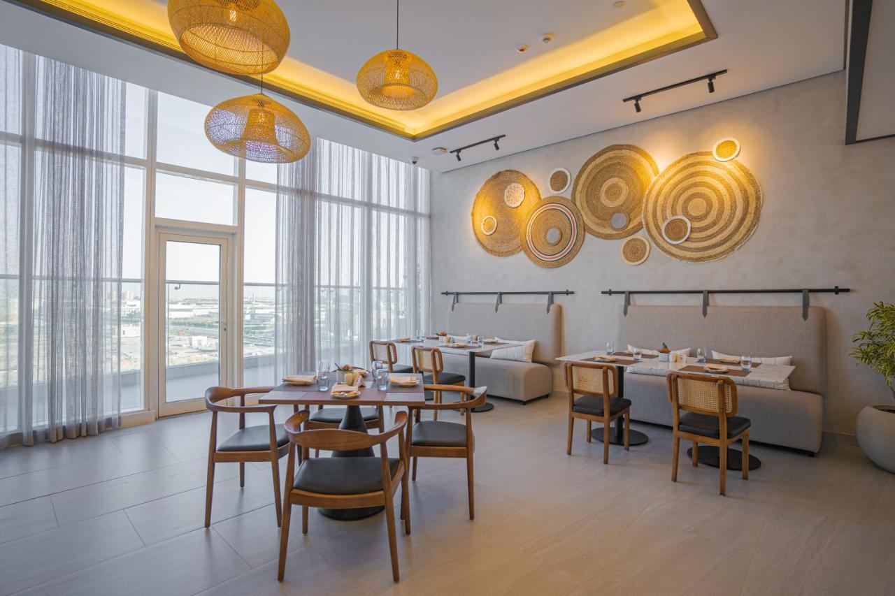 Movenpick Jumeirah Village Triangle Дубай Экстерьер фото The restaurant
