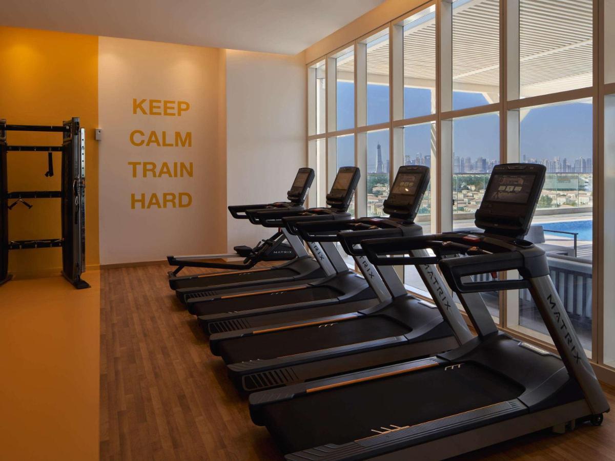 Movenpick Jumeirah Village Triangle Дубай Экстерьер фото The gym at the hotel
