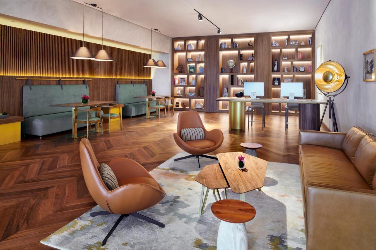 Movenpick Jumeirah Village Triangle Дубай Экстерьер фото The Library at The Hari
