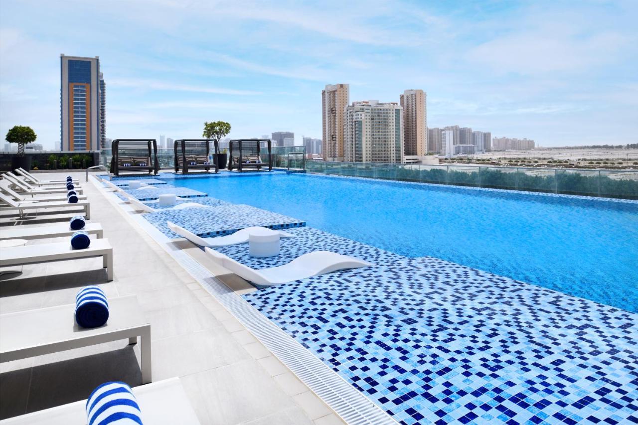 Movenpick Jumeirah Village Triangle Дубай Экстерьер фото Rooftop pool