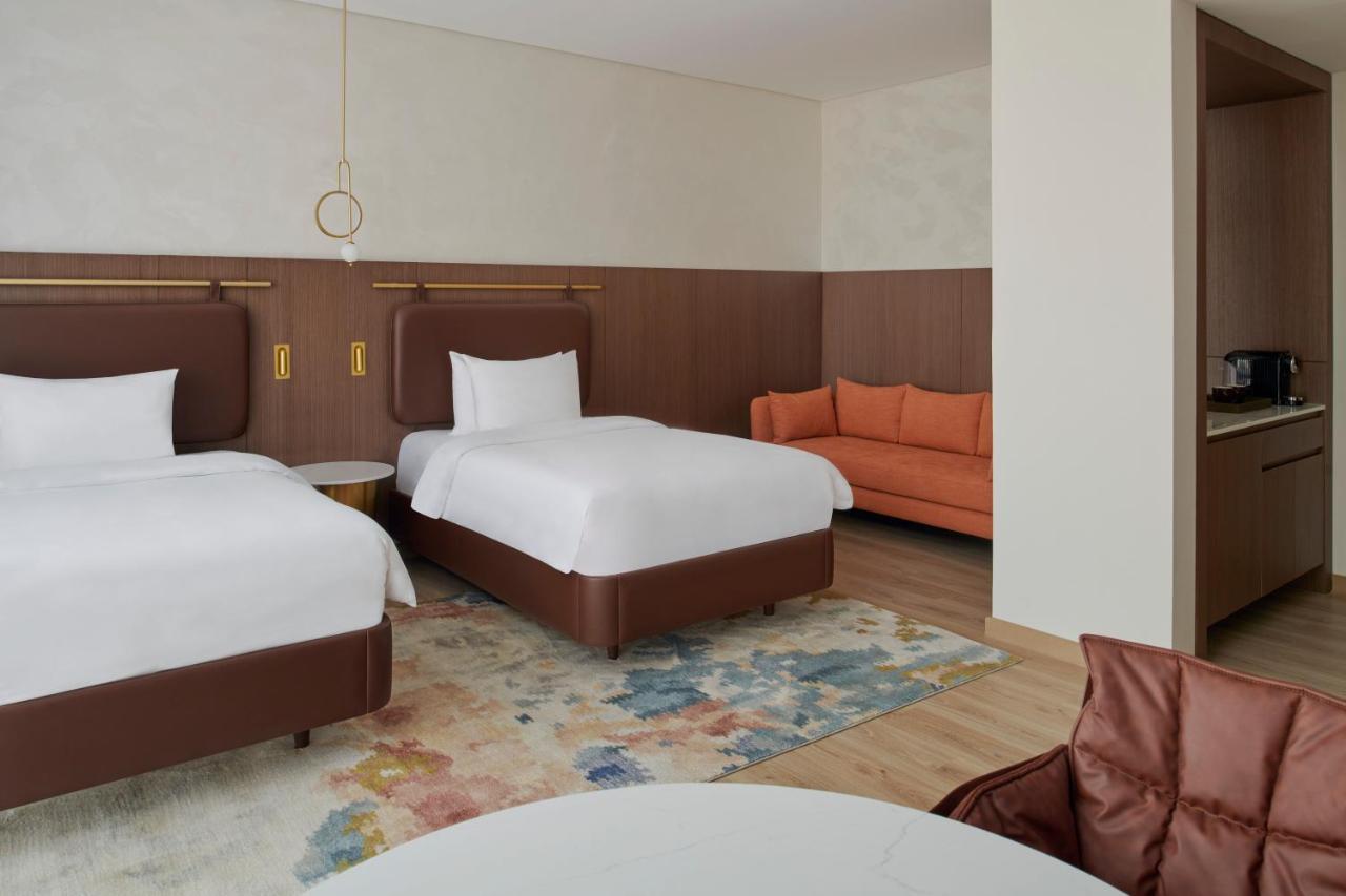 Movenpick Jumeirah Village Triangle Дубай Экстерьер фото A room at the hotel