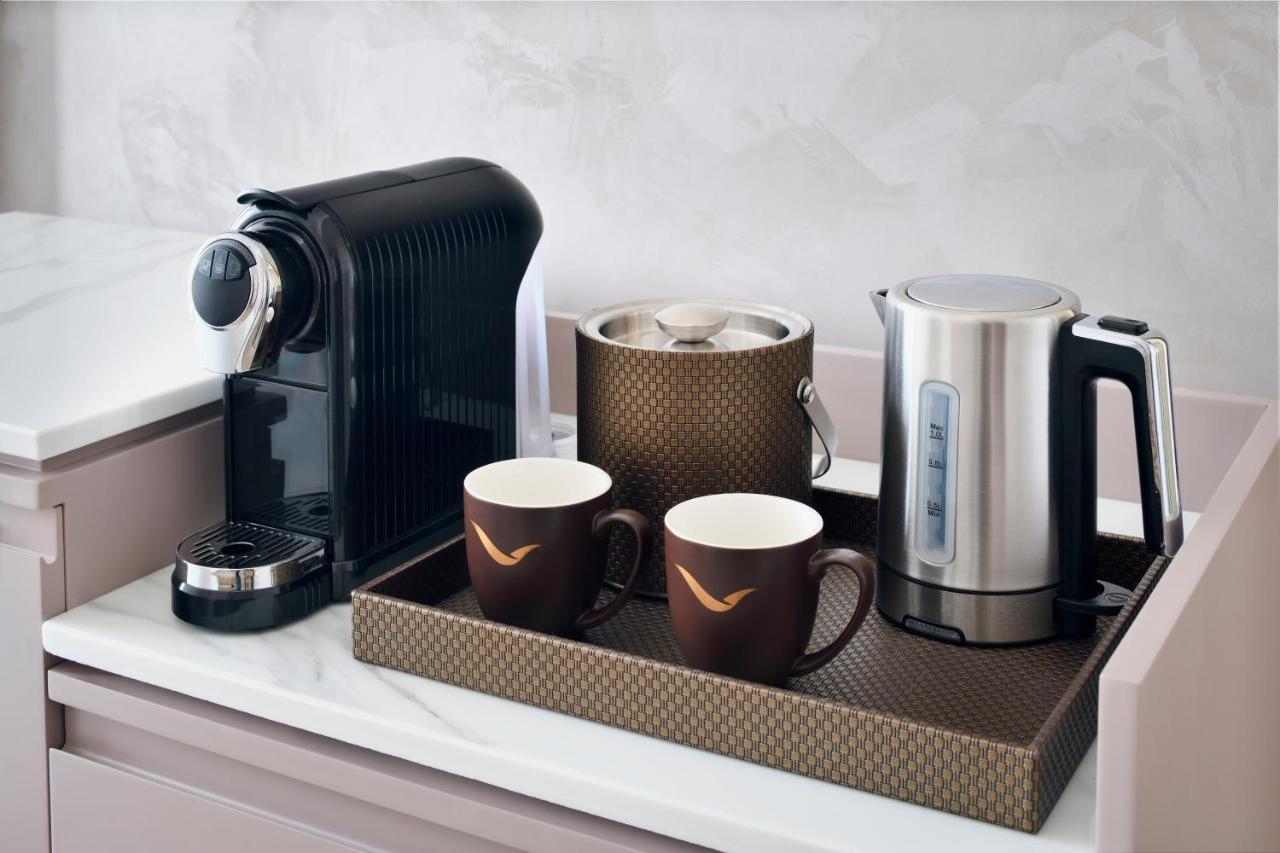Movenpick Jumeirah Village Triangle Дубай Экстерьер фото A Nespresso coffee machine